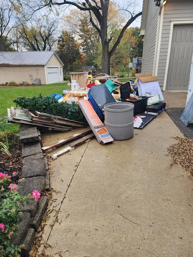 Dumpster being loaded with debris for Commercial Dumpster Rental in North Bergen